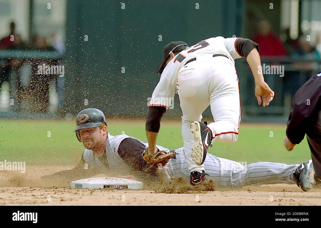 Arizona Diamondbacks' Craig Counsell, bottom, slides safely into third  before San Francisco Giants third baseman Pedro Feliz, top, can get the tag  down in the sixth inning of a baseball game Wednesday