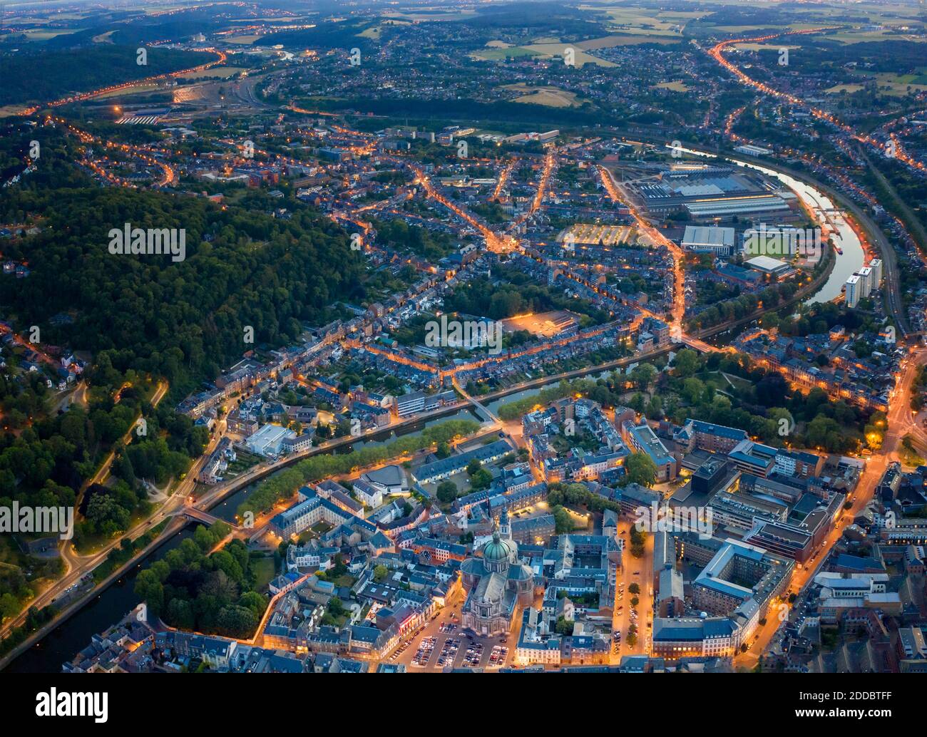 Belgium, Namur Province, Namur, Aerial view of riverside city at dusk Stock Photo