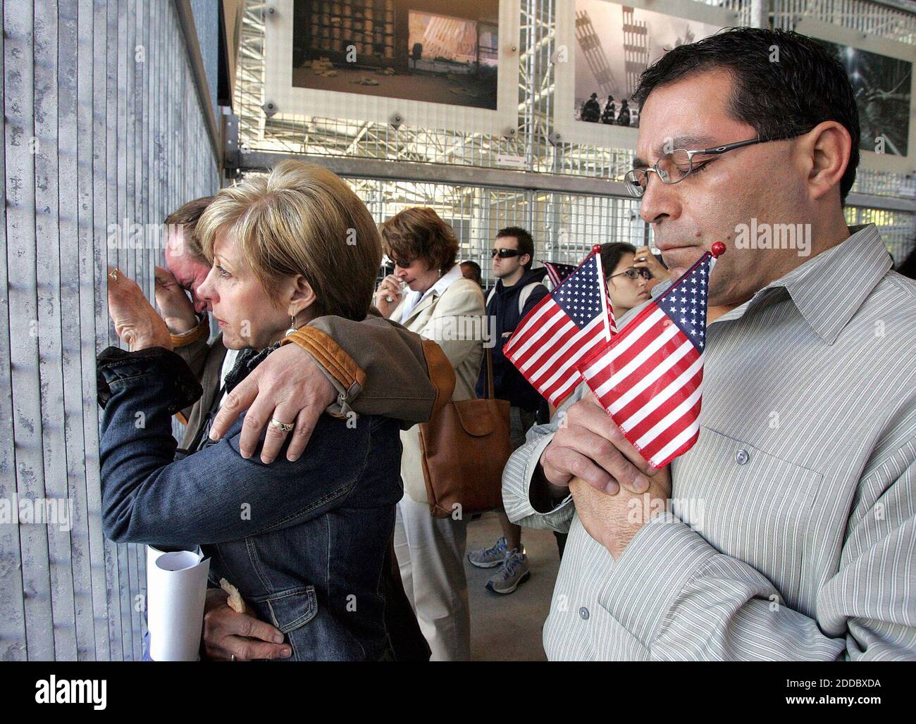 NO FILM, NO VIDEO, NO TV, NO DOCUMENTARY - Mark and Bonnie Laird (left) and Vince Martinez, from Texas, listen during the reading of names outside the World Trade Center PATH station in New York, New York, Monday, September 11, 2006. Photo by Audrey C. Tiernan/Newsday/MCT/ABACAPRESS.COM Stock Photo