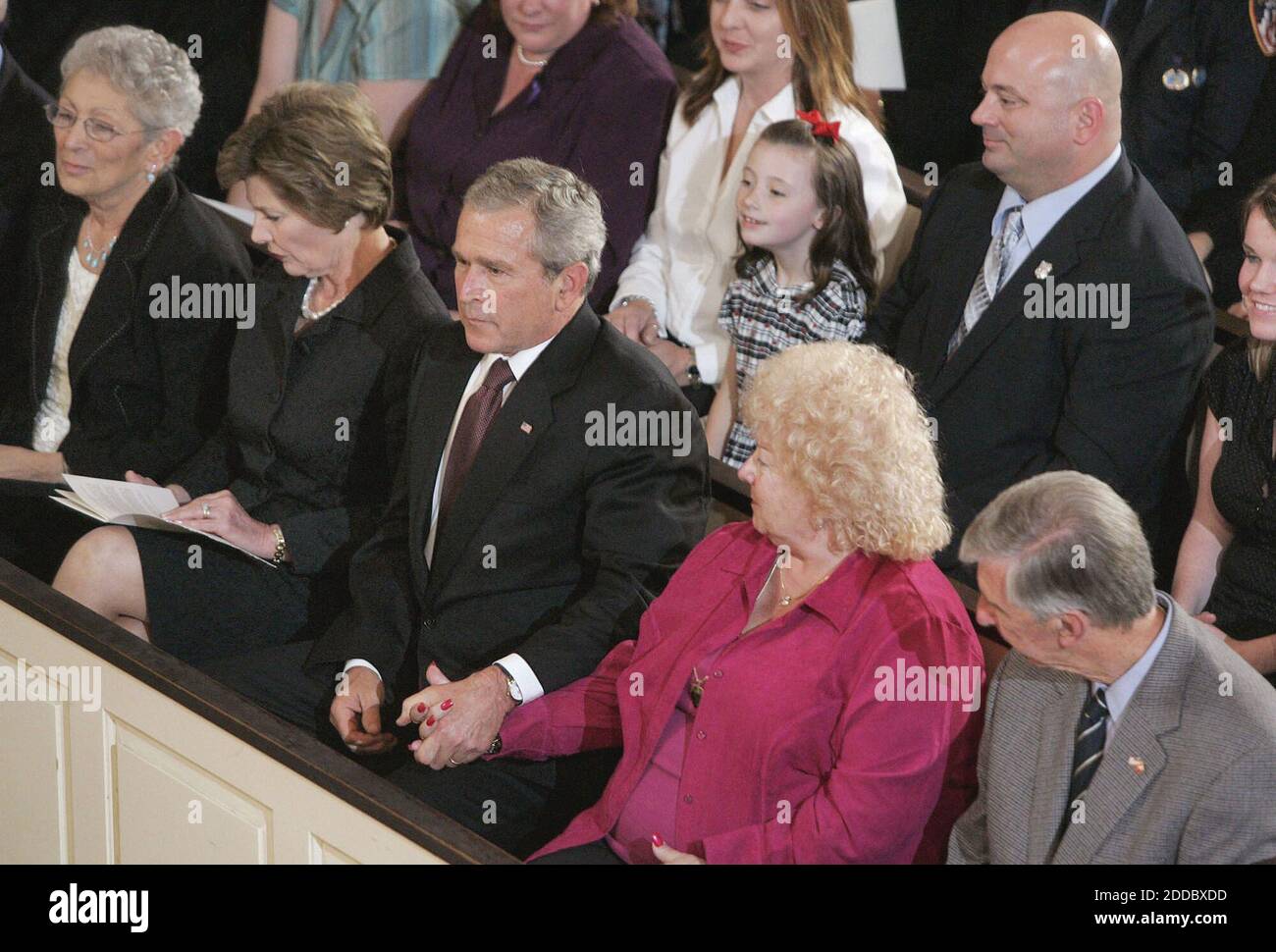 NO FILM, NO VIDEO, NO TV, NO DOCUMENTARY - President George W. Bush and first lady Laura Bush, second from left, join family members who lost loved ones in the terrorist attacks of September 11, for a service of prayer and remembrance at St. Paul's Chapel in Manhattan, Sunday, September 10, 2006. Photo by Charles Eckert/Newsday/MCT/ABACAPRESS.COM Stock Photo