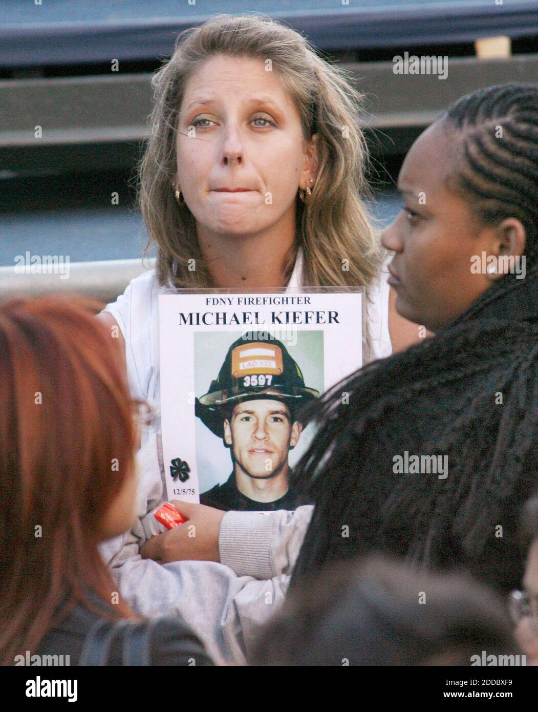 NO FILM, NO VIDEO, NO TV, NO DOCUMENTARY - A woman holds a photo of FDNY firefighter Michael Kiefer at the World Trade Center site during the 2006 September 11th Commemoration Ceremony in New York, New York, Monday, September 11, 2006. Photo by Julia Gaines/Newsday/MCT/ABACAPRESS.COM Stock Photo