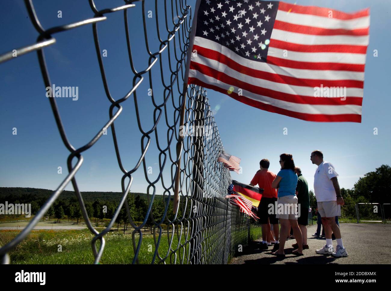 NO FILM, NO VIDEO, NO TV, NO DOCUMENTARY - Visitors peer past the fence to the Flight 93 National Memorial, at the sacred ground of the Flight 93 crash site and the newly completed memorial in Shanksville, Pennsylvania, USA on Friday afternoon, August 12, 2011. The memorial will open to the public on September 10. Photo by Laurence Kesterson/Philadelphia Inquirer/MCT/ABACAPRESS.COM Stock Photo