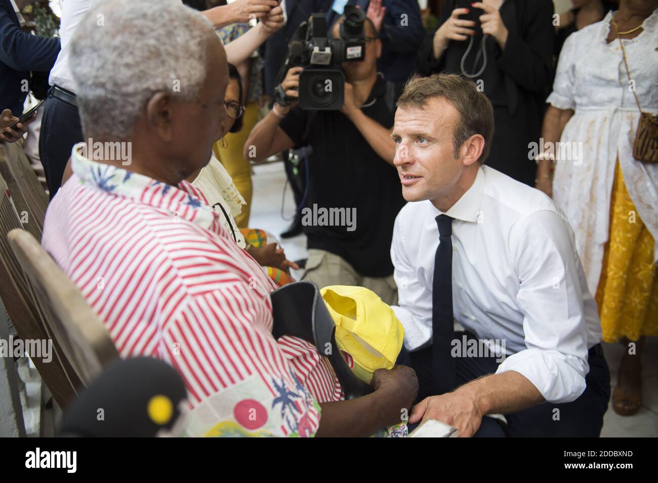 French President Emmanuel Macron During A Visit To A Local Resident On The Theme Of Water
