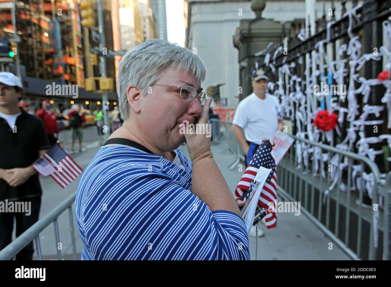 NO FILM, NO VIDEO, NO TV, NO DOCUMENTARY - Kim Warnke, a middle school teacher from Sasnborn, Iowa, is overcome with emotion as she stands before St. Paul's Church, a block from Ground Zero, Sunday, September 11, 2011 in New York. She and her volunteers place paper flowers that her students had created in Iowa and brought with them to New York to be placed on this day. Photo by Michael Bryant/Philadelphia Inquirer/MCT/ABACAPRESS.COM Stock Photo