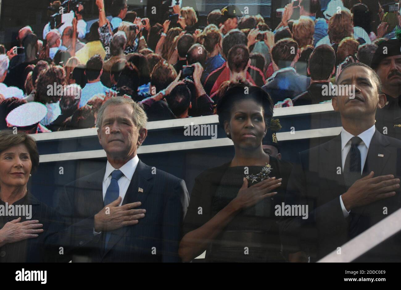 NO FILM, NO VIDEO, NO TV, NO DOCUMENTARY - Former first lady Laura Bush, from left, former President George W. Bush, first lady Michelle Obama and President Barack Obama hold hands to their hearts during the national anthem as friends and relatives of the victims of 9/11 gather for a ceremony marking the 10th anniversary of the attacks at the National September 11 Memorial at the World Trade Center site, Sunday, September 11, 2011, in New York City, NY, USA. Photo by April Saul/Philadelphia Inquirer/MCT/ABACAPRESS.COM Stock Photo
