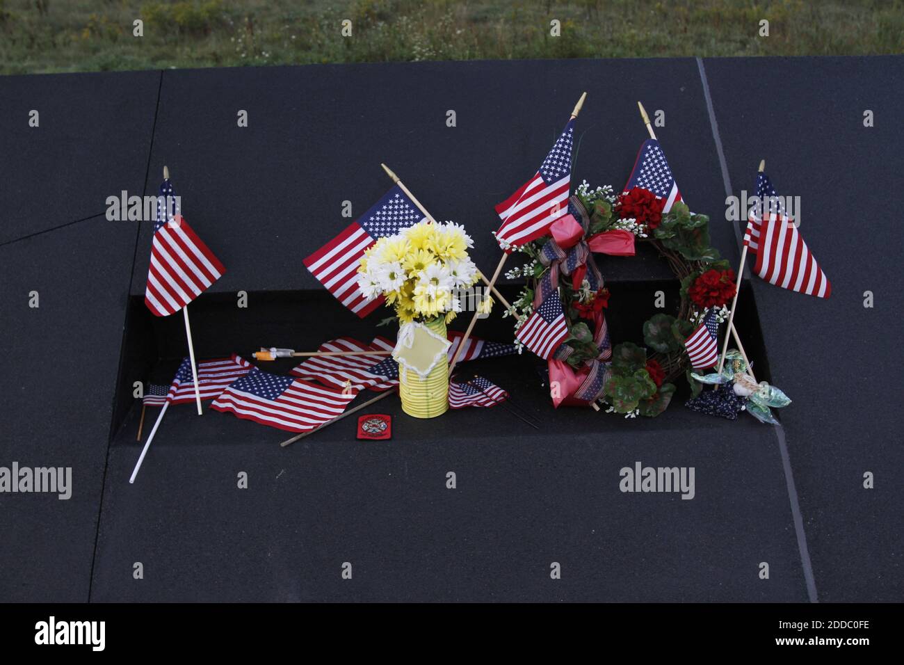 NO FILM, NO VIDEO, NO TV, NO DOCUMENTARY - Flags and tributes are left on the wall on the tenth anniversary of the 9/11 attacks at the new FL93 memorial on Sunday, September 11, 2011 in Shanksville, Pennsylvania. Photo by Laurence Kesterson/Philadelphia Inquirer/MCT/ABACAPRESS.COM Stock Photo
