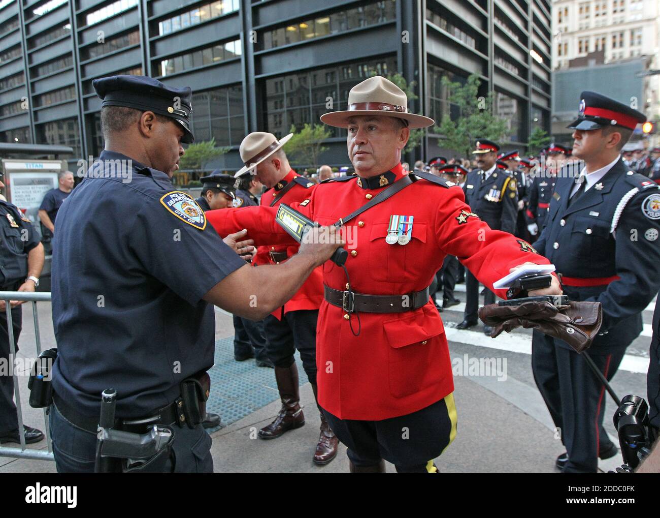 NO FILM, NO VIDEO, NO TV, NO DOCUMENTARY - Corporal David Herard of the Royal Canadian Mount Police is wanded at the security checkpoint at Liberty Park as he and the entire Police contingent from Canada wait to be wanded to pass through security for the 9/11 memorial service in New York City, New York, Sunday, September 11, 2011. Photo by Michael Bryant/Philadelphia Inquirer/MCT/ABACAPRESS.COM Stock Photo