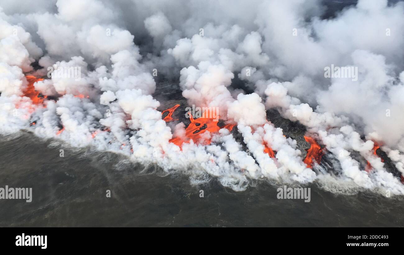 Handout photo of Lava from fissure 8 is entering the sea this morning on the southern portion of the flow front primarily through the open channel, but also along this 1 km (0.6 mi) wide area with multiple laze plumes from smaller oozing lobes. Kīlauea Volcano, HI, USA, June 26, 2018. Photo by USGS via ABACAPRESS.COM Stock Photo