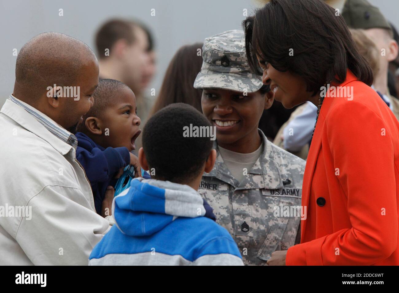 NO FILM, NO VIDEO, NO TV, NO DOCUMENTARY - First lady Michelle Obama makes funny faces with two-year-old Izaiah Garner as she arrives at Raleigh-Durham International Airport on Friday, March 2, 2012. A number of active duty and veteran service members, from all the military branches, and their families were on hand to welcome her to North Carolina. Izaiah's mom Stacy Garner, center, is a staff sergeant with the National Guard. He's being held by his father Darryl Garner, with his brother Tyler looking on. Photo by Shawn Rocco/Raleigh News & Observer/MCT/ABACAPRESS.COM Stock Photo