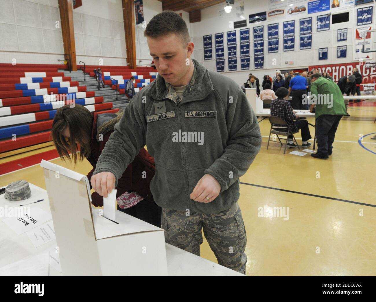 NO FILM, NO VIDEO, NO TV, NO DOCUMENTARY - Airman 1st Class Nathaniel Buck casts his ballot as his wife, Blair, fills hers in at the Alaska Republican Party Presidential Preference Poll at Anchorage Christian School in Anchorage, Alaska, USA on Tuesday, March 6, 2012. Voters in 10 states are at the polls amid Super Tuesday, the most delegate-rich day of the 2012 GOP presidential campaign. Photo by Erik Hill/Anchorage Daily News/MCT/ABACAPRESS.COM Stock Photo