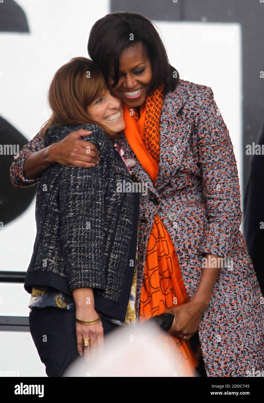NO FILM, NO VIDEO, NO TV, NO DOCUMENTARY - First lady Michelle Obama gives Melinda Cook, a descendant of Dorothy Stratton, a hug during a ceremony for the Coast Guard Cutter Stratton on Coast Guard Island in Alameda, CA, USA ON March 31, 2012. The first lady made the trip to California to join in the commissioning ceremony placing the ship into active service. Mrs. Obama, a sponsor of the Cutter Stratton, helped christen the ship in Pascagoula, Mississippi, in 2010 by breaking a champagne bottle over the bow. Photo by Anda Chu/Oakland Tribune/MCT/ABACAPRESS.COM Stock Photo