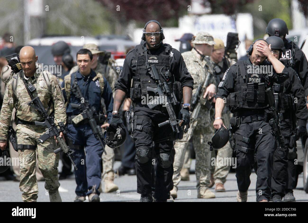 NO FILM, NO VIDEO, NO TV, NO DOCUMENTARY - A SWAT team from the Oakland Police Department leaves the scene of a shooting at Oikos University on Edgewater Dr. in Oakland, Ca, USA on Monday, April 2, 2012. Photo by Gary Reyes/San Jose Mercury News/MCT/ABACAPRESS.COM Stock Photo