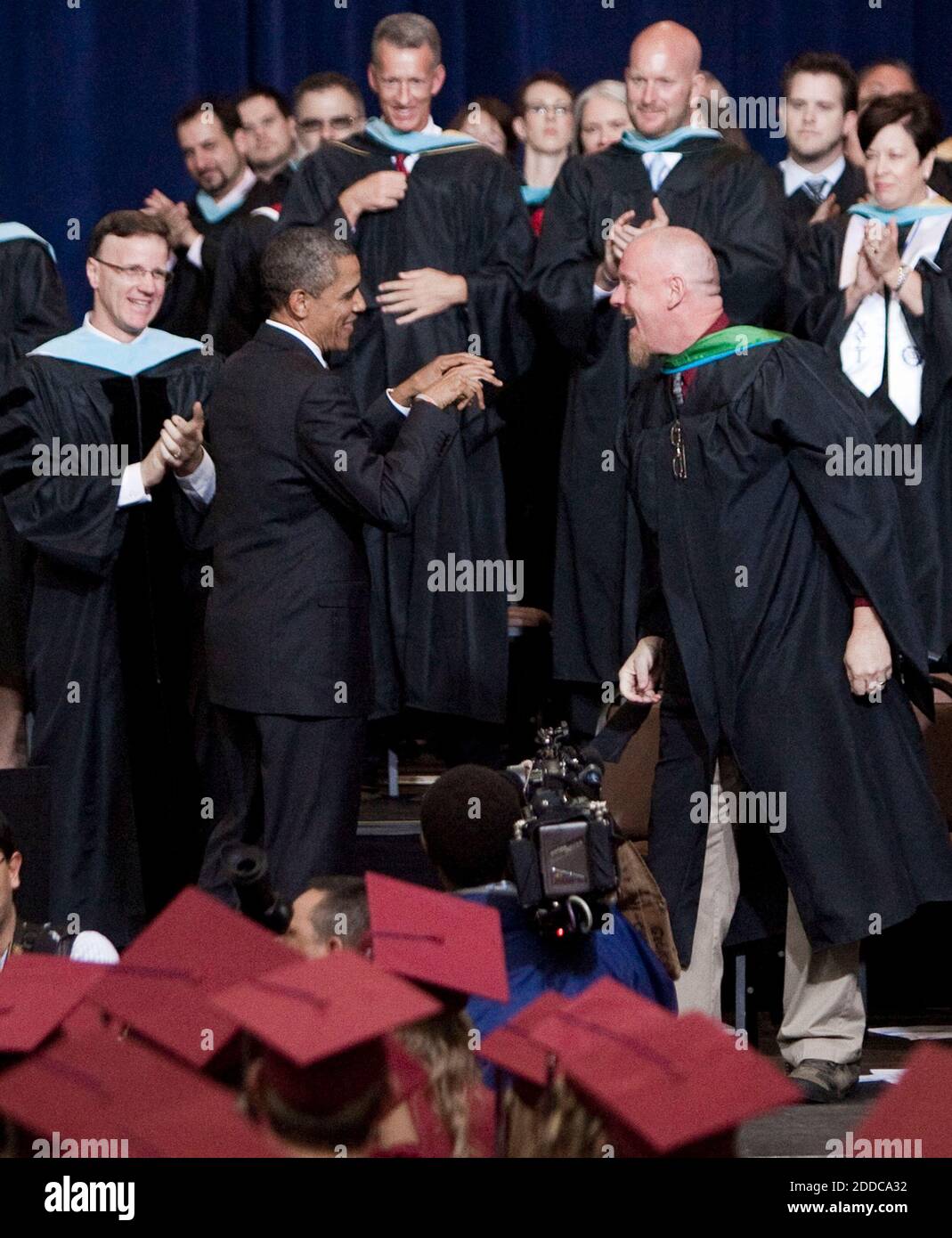 NO FILM, NO VIDEO, NO TV, NO DOCUMENTARY - Mimicking the school's chant President Barack Obama formed his hands into talons as he shared an exchange with Senior Class Principal Dan Hueller during the Joplin High School Commencement Exercises for the Class of 2012 at the Missouri Southern State University Leggett & Platt Athletic Center on Monday, May 21, 2012, in Joplin, Missouri. President Barack Obama spoke at the event in commemoration of the one year anniversary of the city being struck by an EF-5 tornado. Photo by Shane Keyser/Kansas City Star/MCT/ABACAPRESS.COM Stock Photo