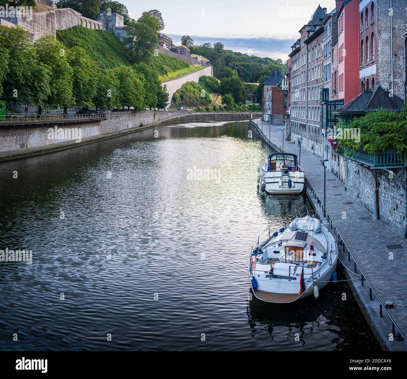 Belgium, Namur Province, Namur, Motorboats moored along city canal Stock Photo