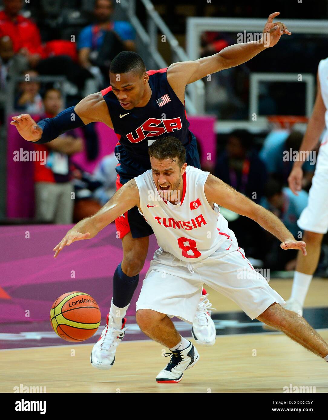 NO FILM, NO VIDEO, NO TV, NO DOCUMENTARY - USA guard Russell Westbrook,  back, fouls Tunisia guard Marouan Kechrid (8) from behind during game  action in group play at the Olympic Park