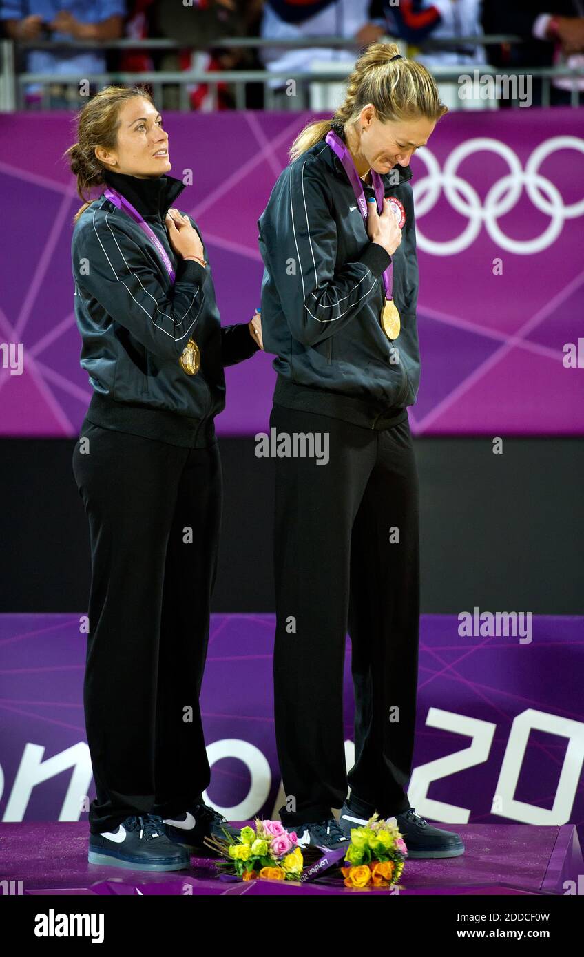 NO FILM, NO VIDEO, NO TV, NO DOCUMENTARY - Misty May-Treanor, left, and Kerri Walsh Jennings, right, both of the United States, reacted during the national anthem in their gold medal ceremony in women's beach volleyball at Horse Guard Parade during the 2012 Summer Olympic Games in London, UK, Wednesday, August 8, 2012. The pair won their third consecutive gold medal in beach volleyball. Photo by David Eulitt/Kansas City Star/MCT/ABACAPRESS.COM Stock Photo