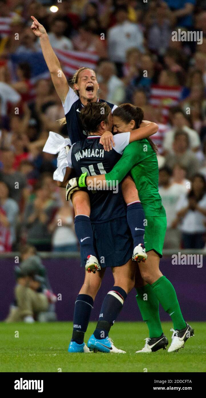 NO FILM, NO VIDEO, NO TV, NO DOCUMENTARY - The U.S. women's soccer team wins its third consecutive Olympic gold medal by beating Japan, 2-1, as Christine Rampone leaps up into the arms of Abby Wambach and goalie Hope Solo, right, after their win at Wembley Stadium in London, UK, on Thursday, August 9, 2012. Photo by Brian Peterson/Minneapolis Star Tribune/MCT/ABACAPRESS.COM Stock Photo