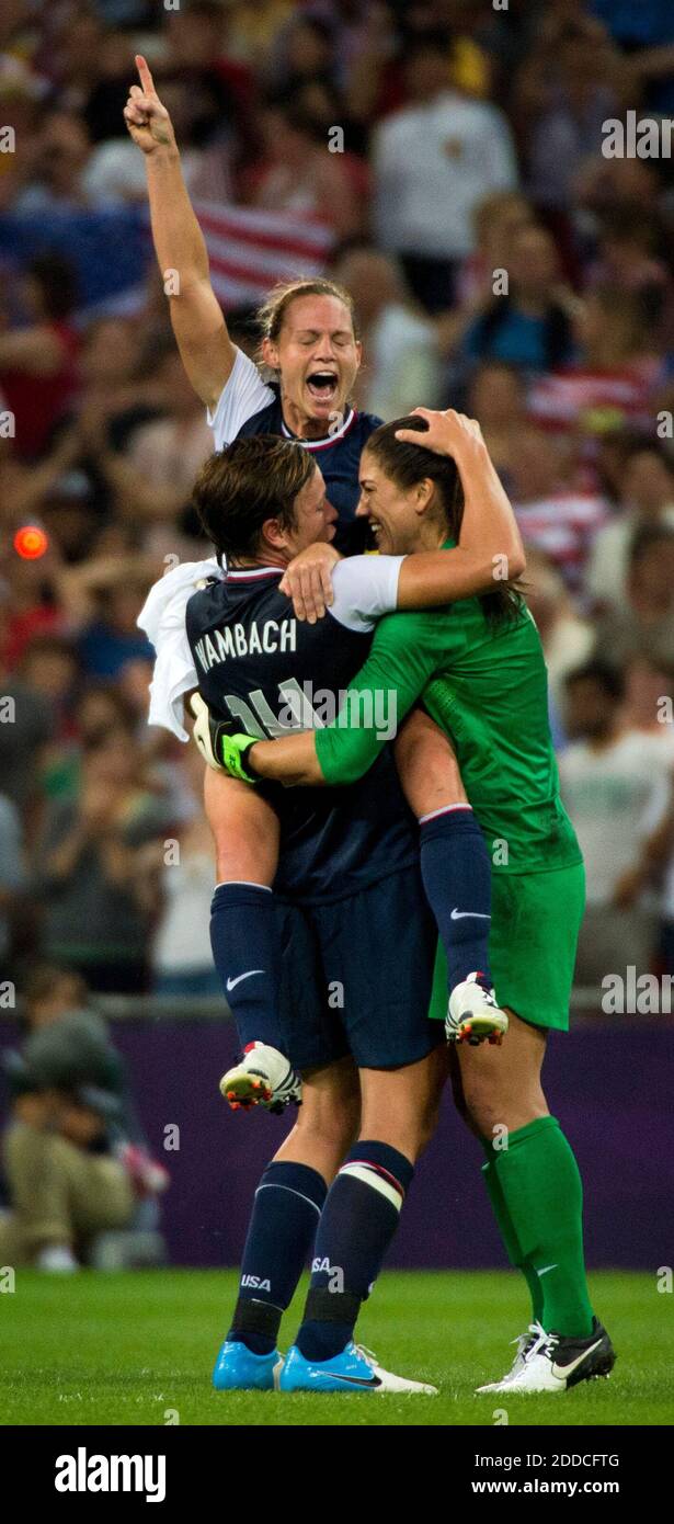 NO FILM, NO VIDEO, NO TV, NO DOCUMENTARY - The U.S. women's soccer team wins its third consecutive Olympic gold medal by beating Japan, 2-1, as Christine Rampone leaps up into the arms of Abby Wambach and goalie Hope Solo, right, after their win at Wembley Stadium in London, UK, on Thursday, August 9, 2012. Photo by Brian Peterson/Minneapolis Star Tribune/MCT/ABACAPRESS.COM Stock Photo
