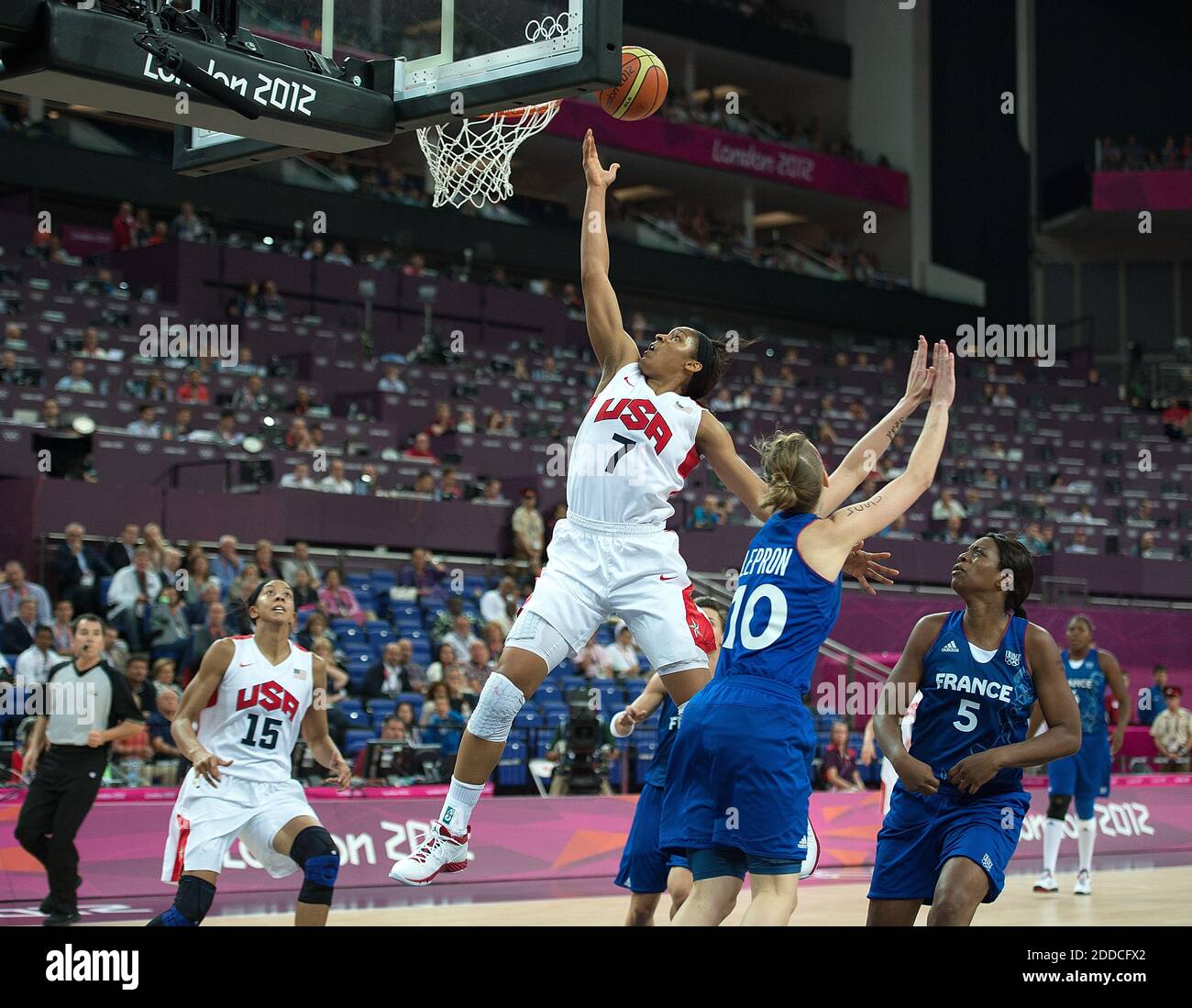 NO FILM, NO VIDEO, NO TV, NO DOCUMENTARY - USA's Maya Moore (7) glides to  the basket over France players during their Gold Medal Basketball game at  the North Greenwich Arena during
