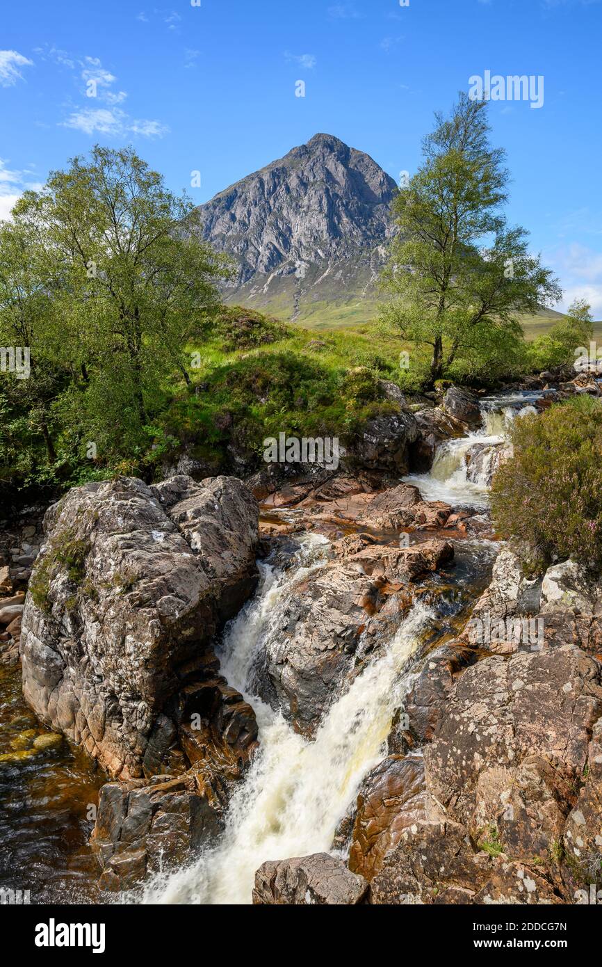 Small waterfall in Glen Etive with Stob Dearg peak in background Stock Photo