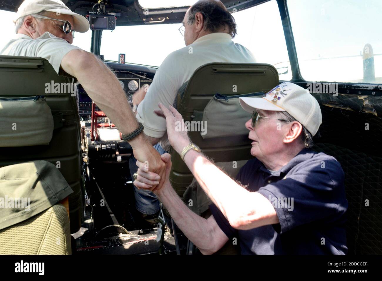 NO FILM, NO VIDEO, NO TV, NO DOCUMENTARY - Warren Kimmel, right, thanks B-17 pilot Neal Morrison after landing back at Trenton Mercer Airport following a short flight in the restored 'Flying Fortress,' August 1,3 2012. He got to ride right up front in the cockpit. Co-pilot is George Daubner. Photo by Tom Gralish/Philadelphia Inquirer/MCT/ABACAPRESS.COM Stock Photo