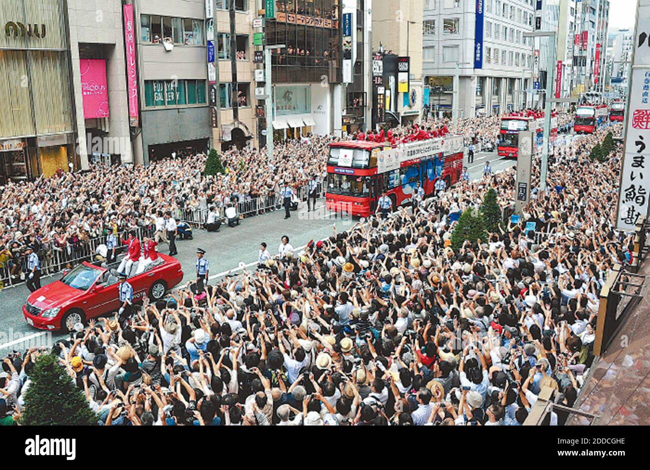 NO FILM, NO VIDEO, NO TV, NO DOCUMENTARY - Buses and cars carrying Japanese Olympic medalists drive past an estimated 500,000 spectators during a parade through Tokyo's Ginza district Monday, August 20, 2012 in Tokyo, Japan. Japan won a record 38 medals in Tokyo, Japan on August 20, 2012. Photo by Yomiuri Shimbun/MCT/ABACAPRESS.COM Stock Photo