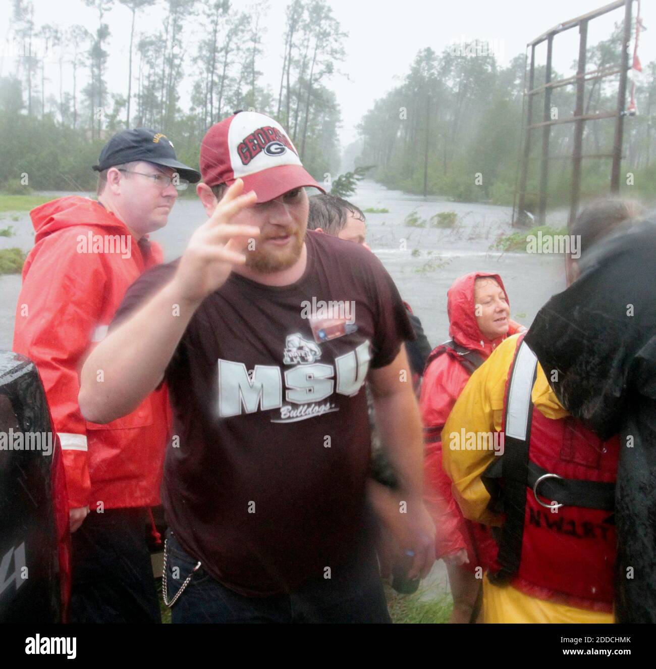 NO FILM, NO VIDEO, NO TV, NO DOCUMENTARY - Anthony Allen, center, thanks the Swift Water Rescue Team after he and two other employees of WQRZ radio station were rescued from the flooded station in the Shoreline Park area of Bay St. Louis, Mississippi, during Hurricane Isaac on Wednesday, August 29, 2012. Photo by John Fitzhugh/Biloxi Sun Herald/MCT/ABACAPRESS.COM Stock Photo