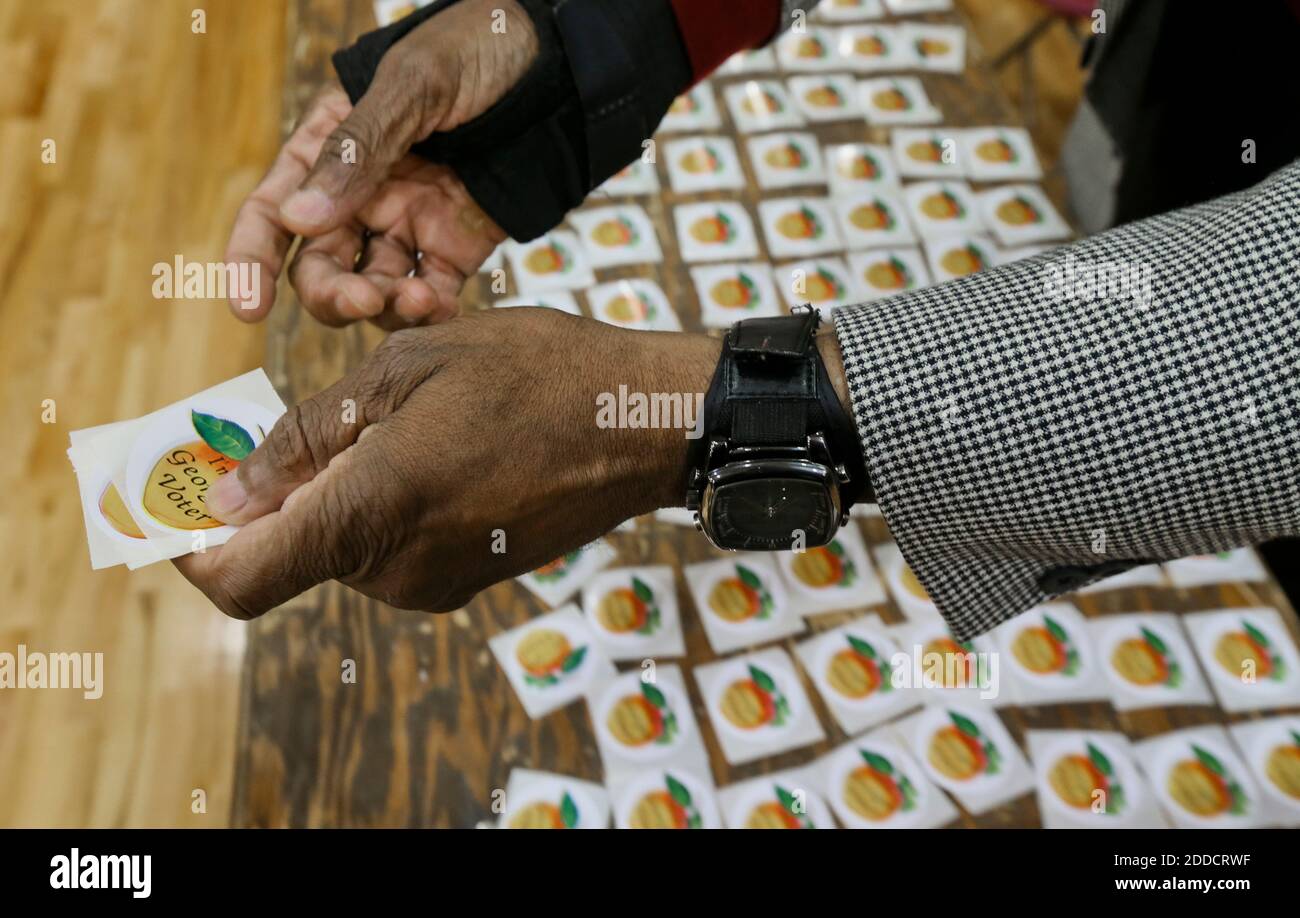 NO FILM, NO VIDEO, NO TV, NO DOCUMENTARY - Poll worker Abdulkarim Muhammad passes out stickers to voters at Grady High School on Election Day, Tuesday, November 6, 2012, in Atlanta, Georgia. Photo by John Spink/Atlanta Journal-Constitution/MCT/ABACAPRESS.COM Stock Photo