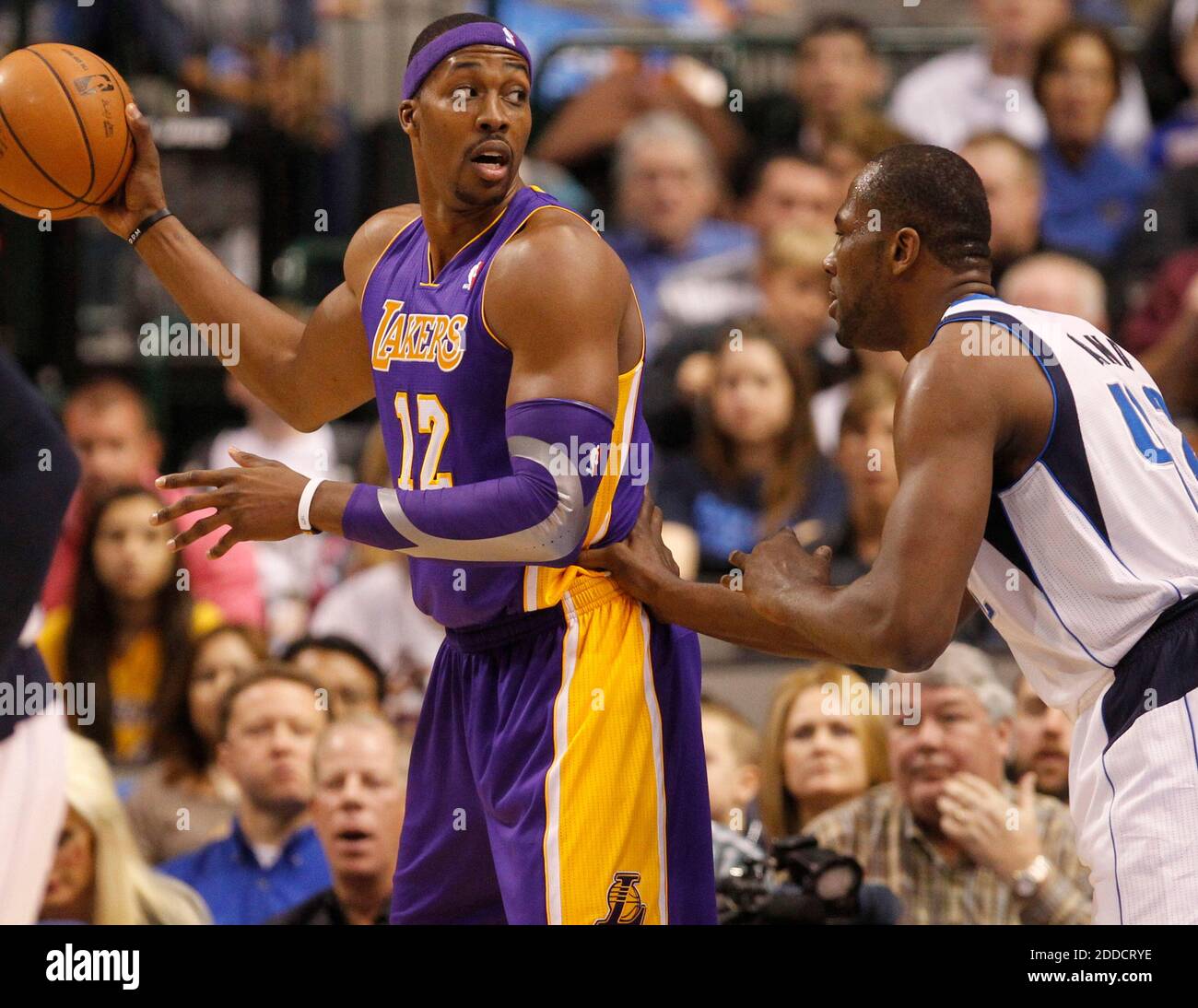 Los Angeles Lakers forward Ron Artest, left, with hair dyed blonde and  purple letters in three different languages, greets Orlando Magic center  Dwight Howard prior to the start of an NBA basketball