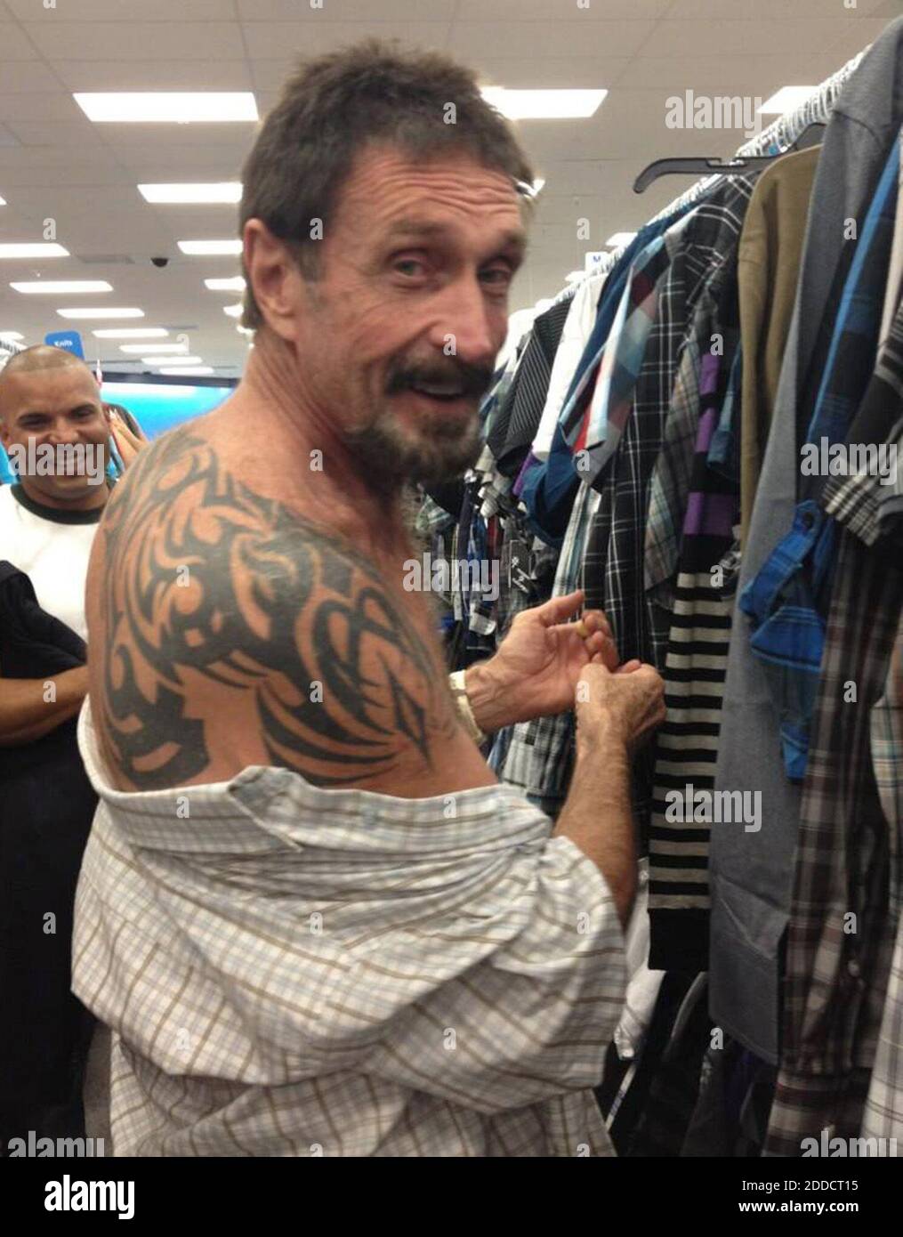 NO FILM, NO VIDEO, NO TV, NO DOCUMENTARY John McAfee shows off his