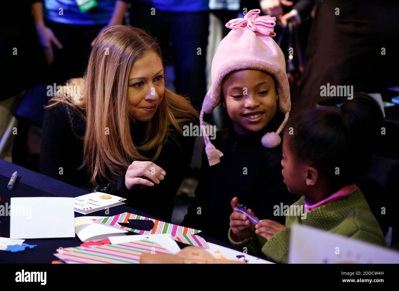 NO FILM, NO VIDEO, NO TV, NO DOCUMENTARY - Chelsea Clinton works on a crafts project with Addison Rose, 8, and Auden Easter, 4, during a National Day of Service kickoff event on the National Mall in Washington, DC, USA, Saturday, January 19, 2013. Photo by Brian Cassella/Chicago Tribune/MCT/ABACAPRESS.COM Stock Photo