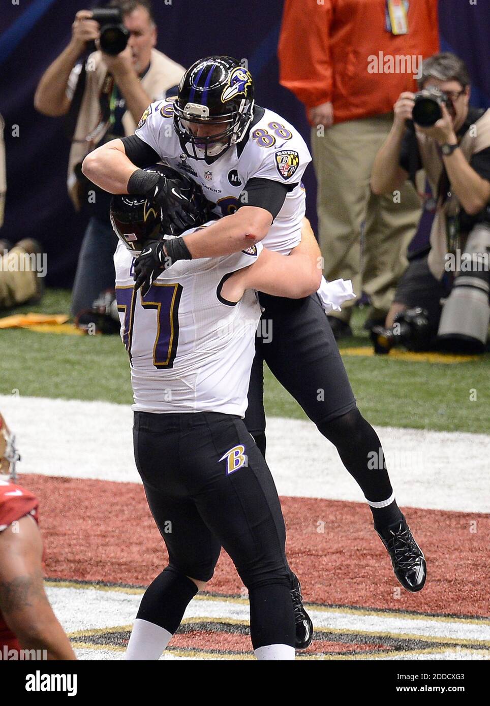 NO FILM, NO VIDEO, NO TV, NO DOCUMENTARY - Dennis Pitta (88) of the Baltimore Ravens celebrates with teammate Matt Birk (77) after scoring on a 1-yard TD pass in the first half of Super Bowl XLVII at the Mercedes-Benz Superdome in New Orleans, Louisiana, USA, Sunday, February 3, 2013. Photo by Harry E. Walker/MCT/ABACAPRESS.COM Stock Photo