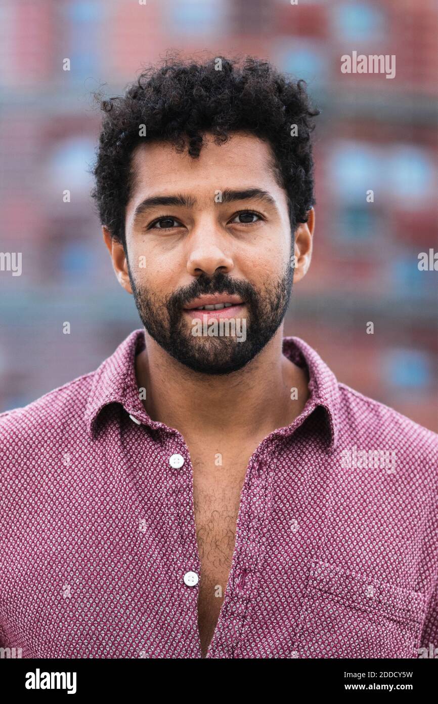 Portrait man wearing pink shirt hi-res stock photography and images - Alamy