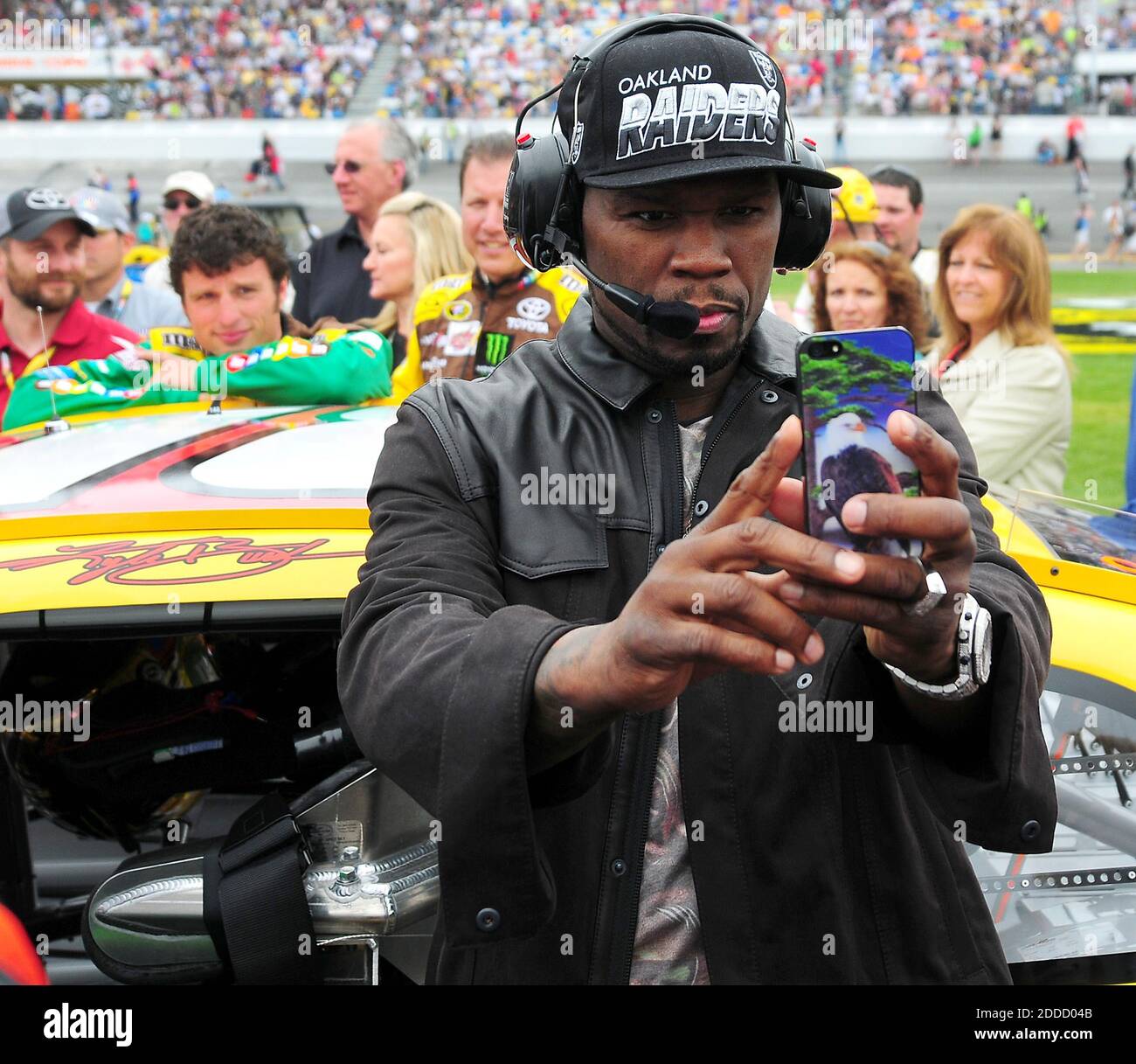 NO FILM, NO VIDEO, NO TV, NO DOCUMENTARY - Rapper 50 Cent stands on pit ...