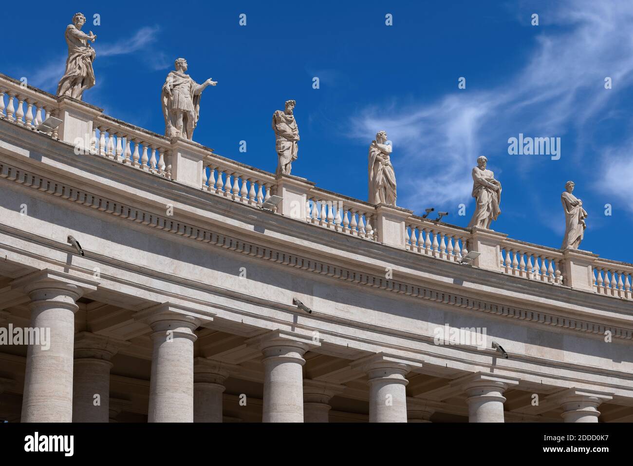 Saint statues on St. Peter's Basilica against blue sky on sunny day, Vatican City, Rome, Italy Stock Photo