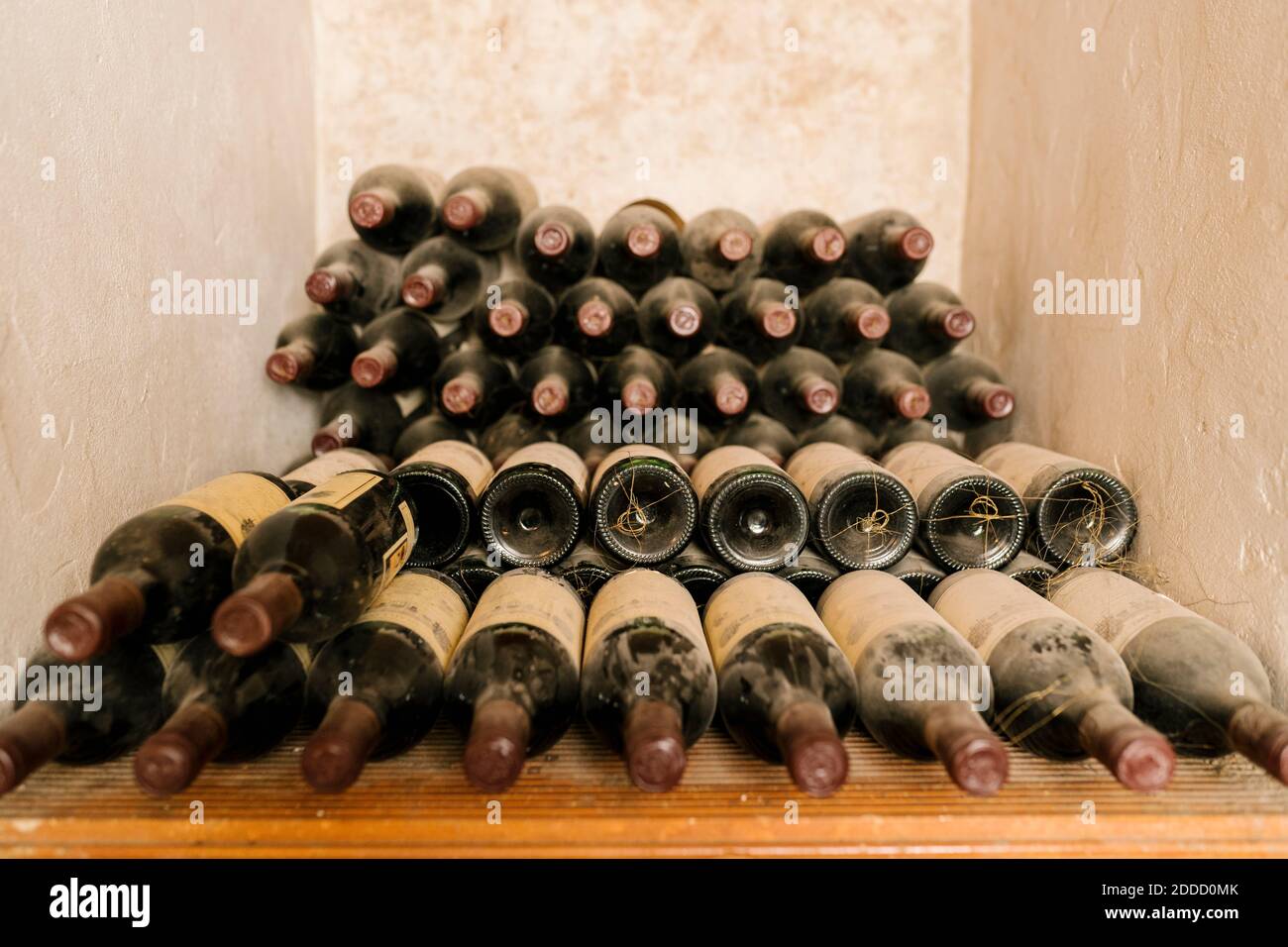 Stack of old wine bottles at cellar Stock Photo Alamy