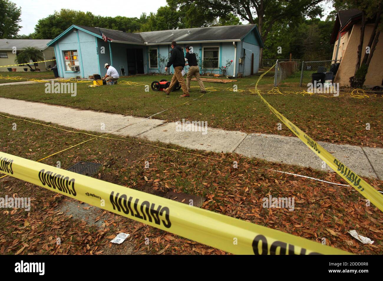NO FILM, NO VIDEO, NO TV, NO DOCUMENTARY - Engineers access the situation at 240 Faithway Drive in Seffner, Florida, Friday, March 1, 2013. A Florida man was feared dead after a sinkhole suddenly opened up under the bedroom of his suburban Tampa home and swallowed him, police and fire officials said. Rescuers responded to a 911 call late on Thursday after the family of Jeff Bush, 36, reported hearing a loud crash in the house and rushed to his bedroom. Photo by Skip O'Rourke/Tampa Bay Times/MCT/ABACAPRESS.COM Stock Photo
