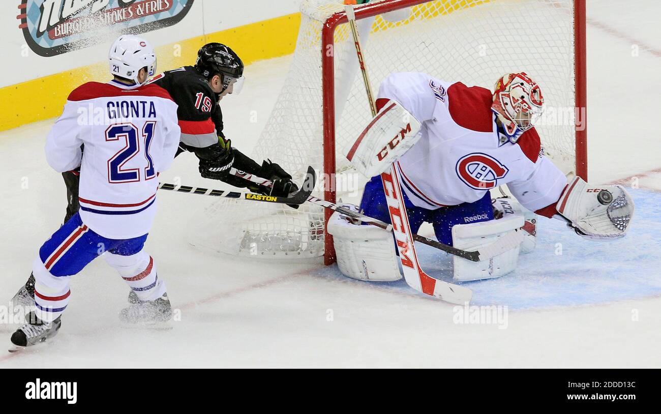 NO FILM, NO VIDEO, NO TV, NO DOCUMENTARY - The Carolina Hurricanes' Jiri Tlusty (19) is stopped by the Montreal Canadiens' Brian Gionta (21) and goalie Carey Price (31) during the second period at the PNC Arena in Raleigh, NC, USA on March 7, 2013. Photo by Chris Seward/Raleigh News & Observer/MCT/ABACAPRESS.COM Stock Photo