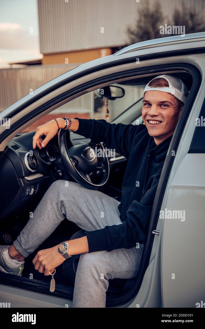 Man sitting at wheel of car hi-res stock photography and images - Alamy