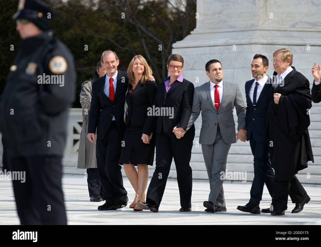 NO FILM, NO VIDEO, NO TV, NO DOCUMENTARY - Attorneys David Bois (left) and Ted Olson (right) walk out of the U.S. Supreme Court with plaintiffs, from left, Sandy Stier, Kris Perry, Jeff Zarillo, and Paul Katami, after California's Proposition 8 was argued before the Court in Washington, D.C., Teusday, March 26, 2013. Photo by Molly Riley/MCT/ABACAPRESS.COM Stock Photo