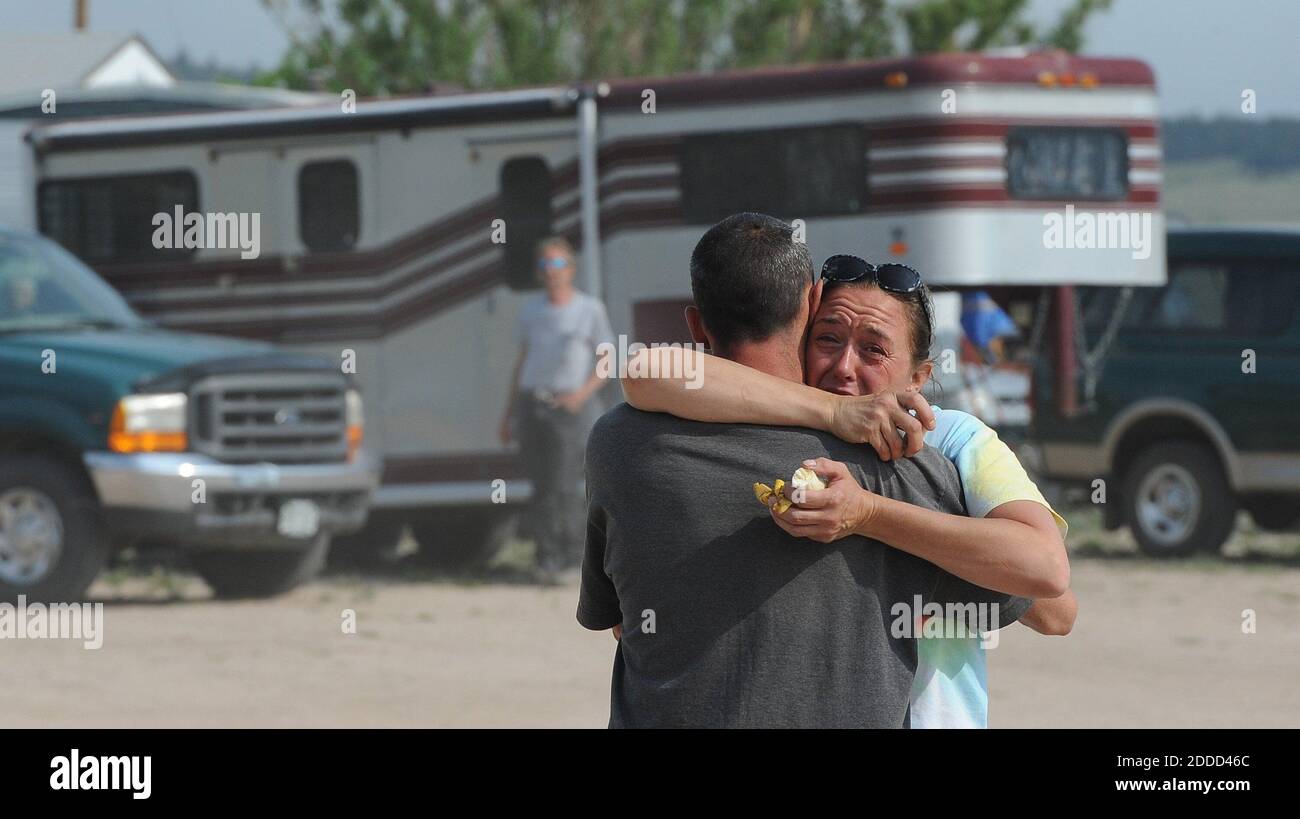 NO FILM, NO VIDEO, NO TV, NO DOCUMENTARY - Michelle Andree hugs Phelan Warren before advancing into the Black Forest Fire area to rescue animals, Thursday, June 13, 2013, in Colorado Springs, Colorado, USA. Andree lost her home in the fire and has been spending the days rescuing animals with the Kit Carson Riding Club. Photo by Jerilee Bennett /Colorado Springs Gazette/MCT/ABACAPRESS.COM Stock Photo