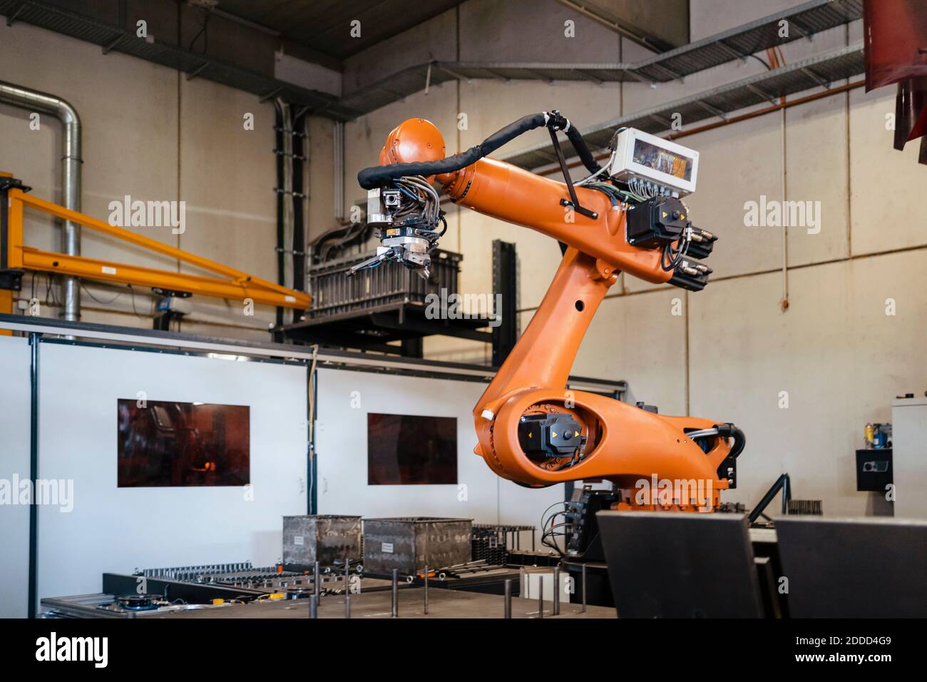 Industrial robots welding in factory Stock Photo