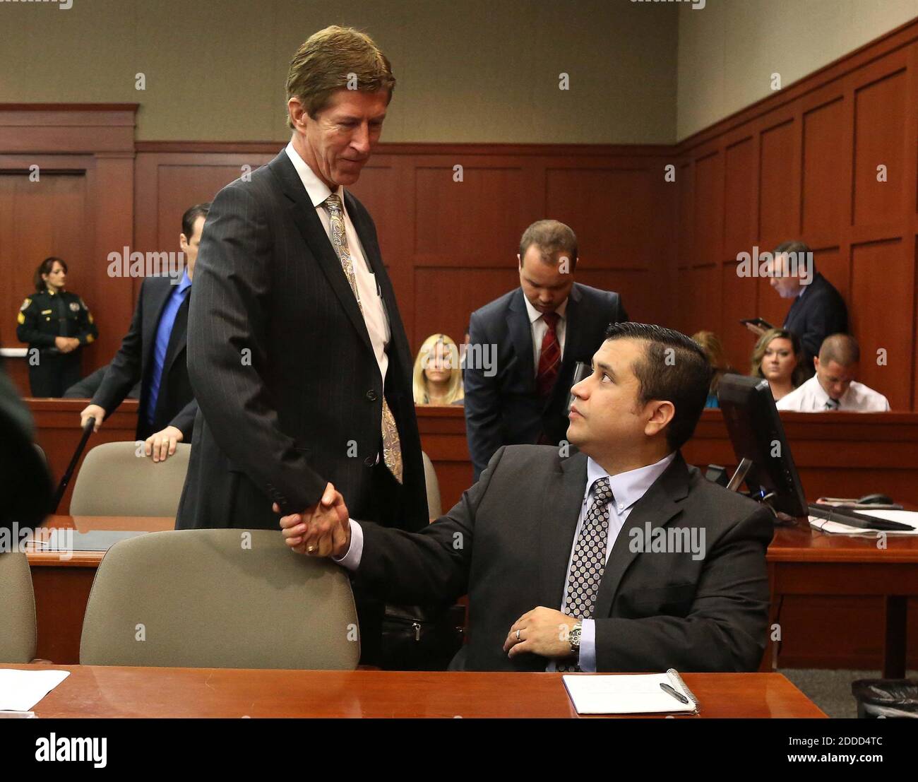 NO FILM, NO VIDEO, NO TV, NO DOCUMENTARY - George Zimmerman is greeted by defense attorney Mark O'Mara, left, in Seminole circuit court, on the 11th day of his trial, in Sanford, Florida, USA, Monday, June 24, 2013. Zimmerman is accused in the fatal shooting of Trayvon Martin. Photo by Joe Burbank/Orlando Sentinel/MCT/ABACAPRESS.COM Stock Photo