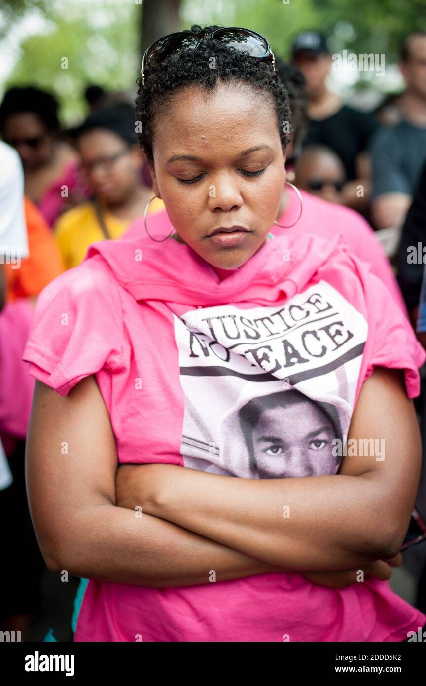 NO FILM, NO VIDEO, NO TV, NO DOCUMENTARY - Larc Pickett, 27, of Woodbridge, Virginia, bows her head in prayer at the start of the 'Justice for Trayvon' rally at the E. Barrett Prettyman Federal Courthous in Washington, D.C., USA, Saturday, July 20, 2013. 'I think we all understand the injustice,' she said. 'This is a reminder of what we have to fight for and this is why I've come down; to fight for the future of my children and all children as well.' Photo by Andre Chung/MCT/ABACAPRESS.COM Stock Photo