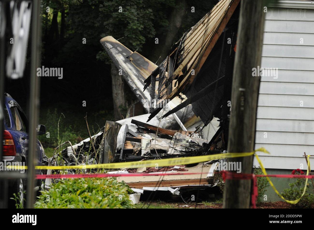 NO FILM, NO VIDEO, NO TV, NO DOCUMENTARY - The wreckage of a plane that crashed into two houses in East Haven, Connecticut, USA, Friday, August 9, 2013, is visible between the homes. Photo by Cloe Poisson/Hartford Courant/MCT/ABACAPRESS.COM Stock Photo