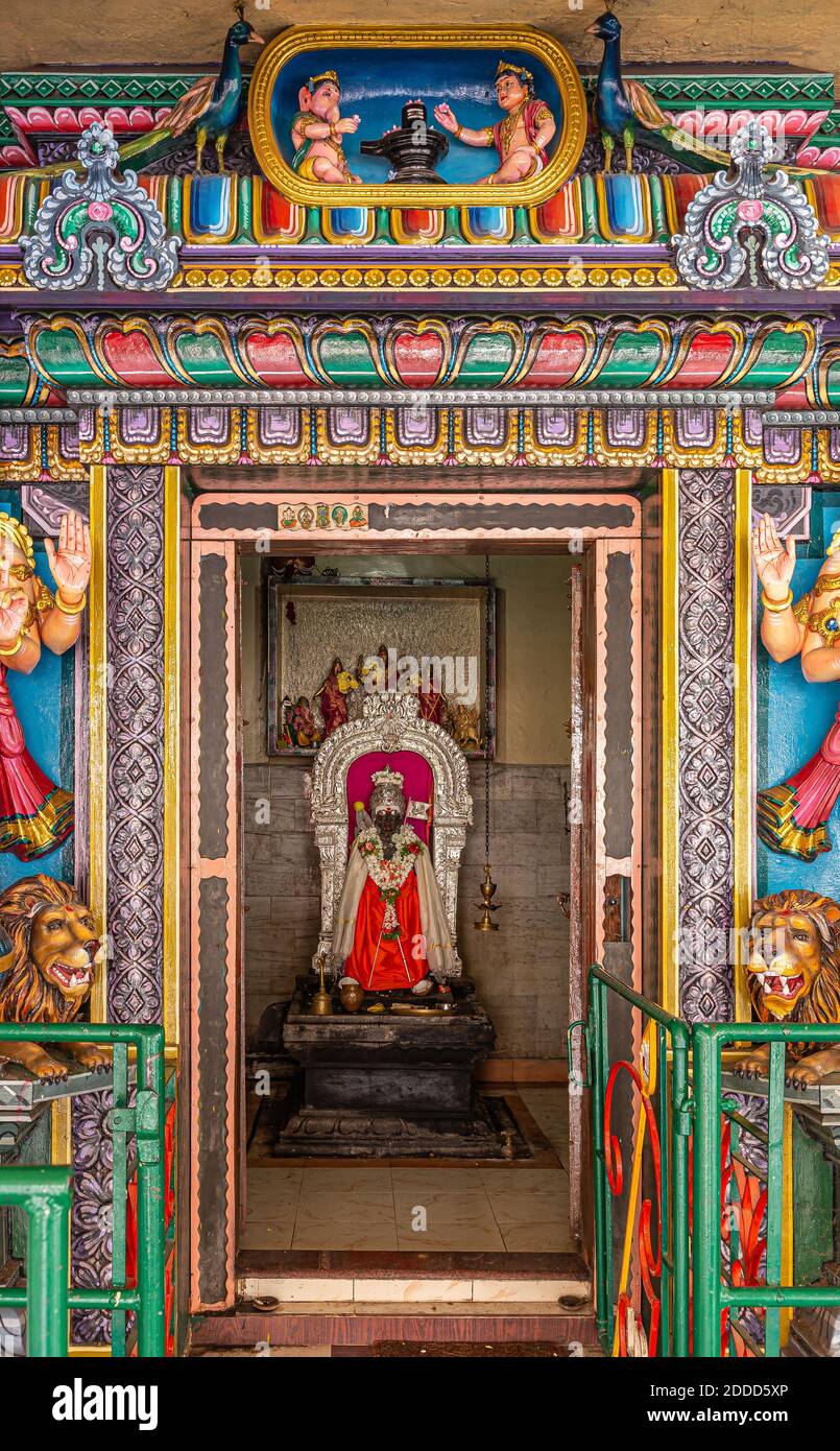 Kadirampura, Karnataka, India - November 4, 2013: Sri Murugan Temple. Niche shrine with colorful decorations with Shivalingam in Yoni representing Lor Stock Photo