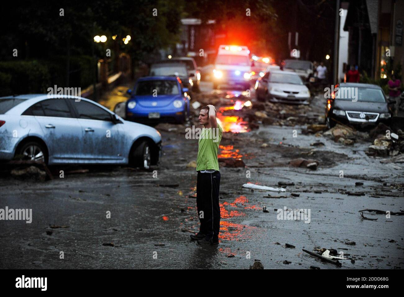 NO FILM, NO VIDEO, NO TV, NO DOCUMENTARY - Carson Dennis stands in the middle of the destruction caused by a flash flood that poured down Canon Avenue in Manitou Springs, Colorado, USA, Friday, August 9, 2013. Photo by Michael Ciaglo/Colorado Springs Gazette/MCT/ABACAPRESS.COM Stock Photo