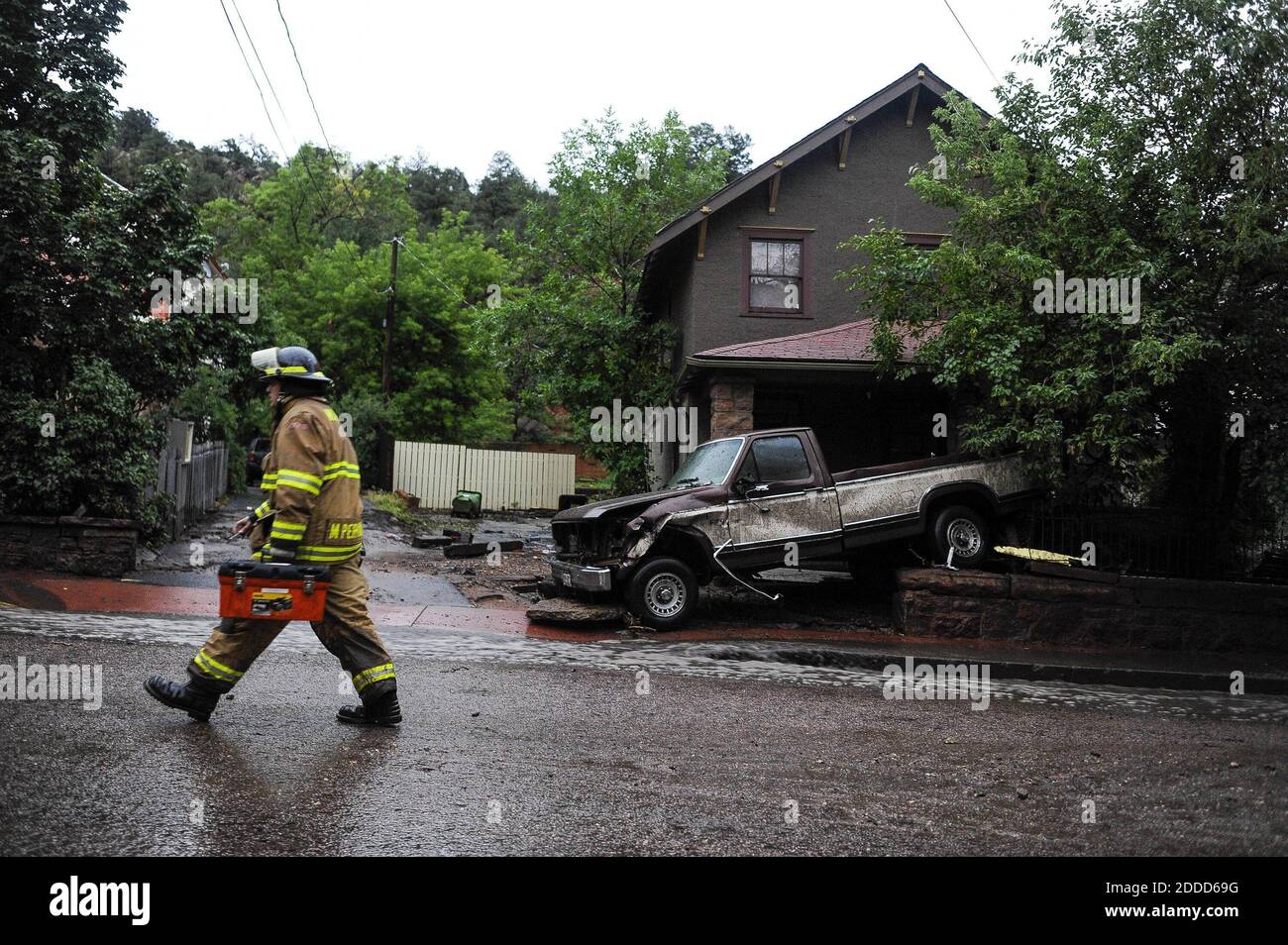 NO FILM, NO VIDEO, NO TV, NO DOCUMENTARY - A firefighter walks up Canon Avenue in Manitou Springs, Colorado, after another flash flood hit the area Friday, August 9, 2013. Photo by Michael Ciaglo/Colorado Springs Gazette/MCT/ABACAPRESS.COM Stock Photo