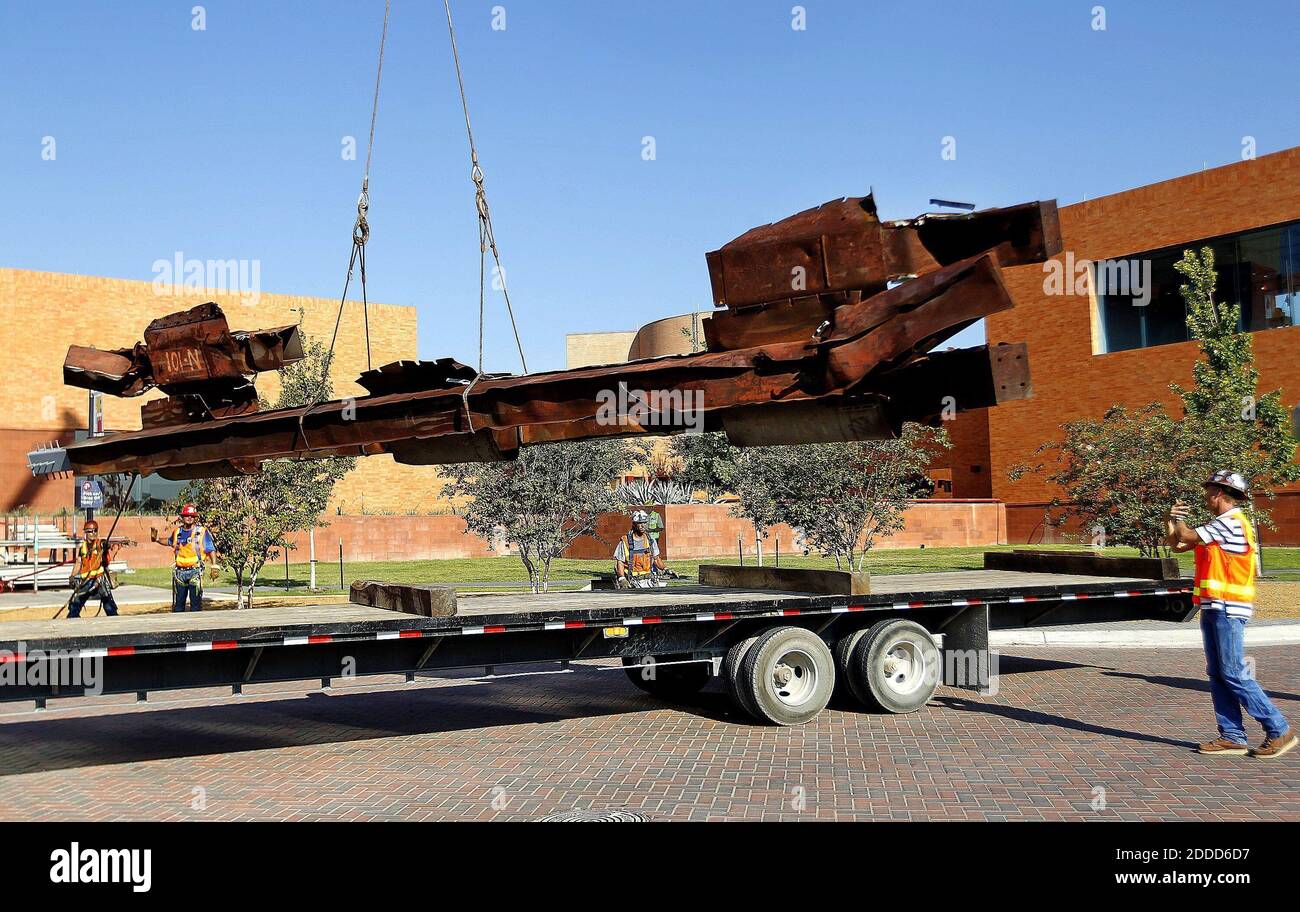 NO FILM, NO VIDEO, NO TV, NO DOCUMENTARY - Twisted steel from the World Trade Center is moved from a flat bed truck by contractors from Austin Commercial Tuesday, September 3, 2013, in Fort Worth, TX, USA. The steel beam that was located just above the 100th story of the north tower of the Worth Trade Center will be on permanent display at the Fort Worth Museum of Science and History. Photo by Ron Jenkins/Fort Worth Star-Telegram/MCT/ABACAPRESS.COM Stock Photo