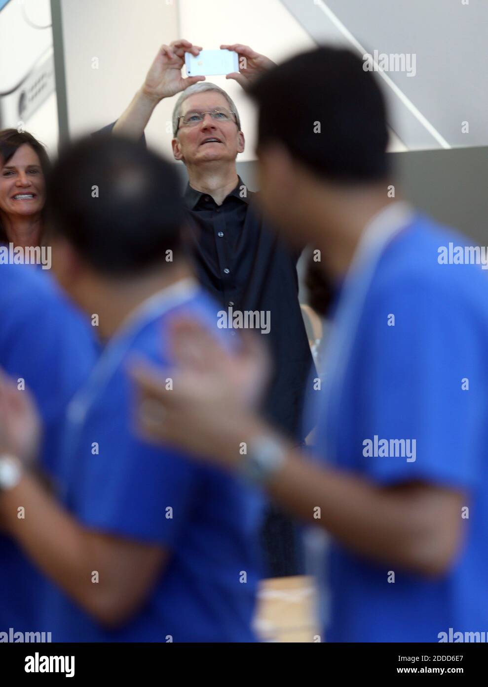 NO FILM, NO VIDEO, NO TV, NO DOCUMENTARY - Apple Chief Executive Officer Tim Cook takes pictures during the release of the new iPhone 5s and 5c at the Apple Store on University Avenue in Palo Alto, California, USA, Friday, Sept. 20, 2013. Customers lined up around the block to be some of the first to get their new phones. Photo by Jane Tyska/Bay Area News Group/MCT/ABACAPRESS.COM Stock Photo